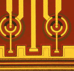 The readout nodes of a finished pnCCD chip with an on-chip JFET transistor showing several structured isolation layers covered by a structured aluminum layer which contacts implanted areas.